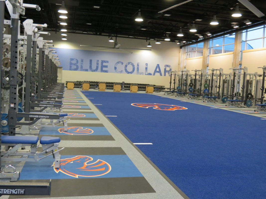 Wall and floor graphics at a Boise State Football Training facility