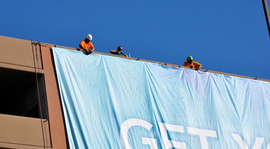 large format banner hung from a parking garage in las vegas